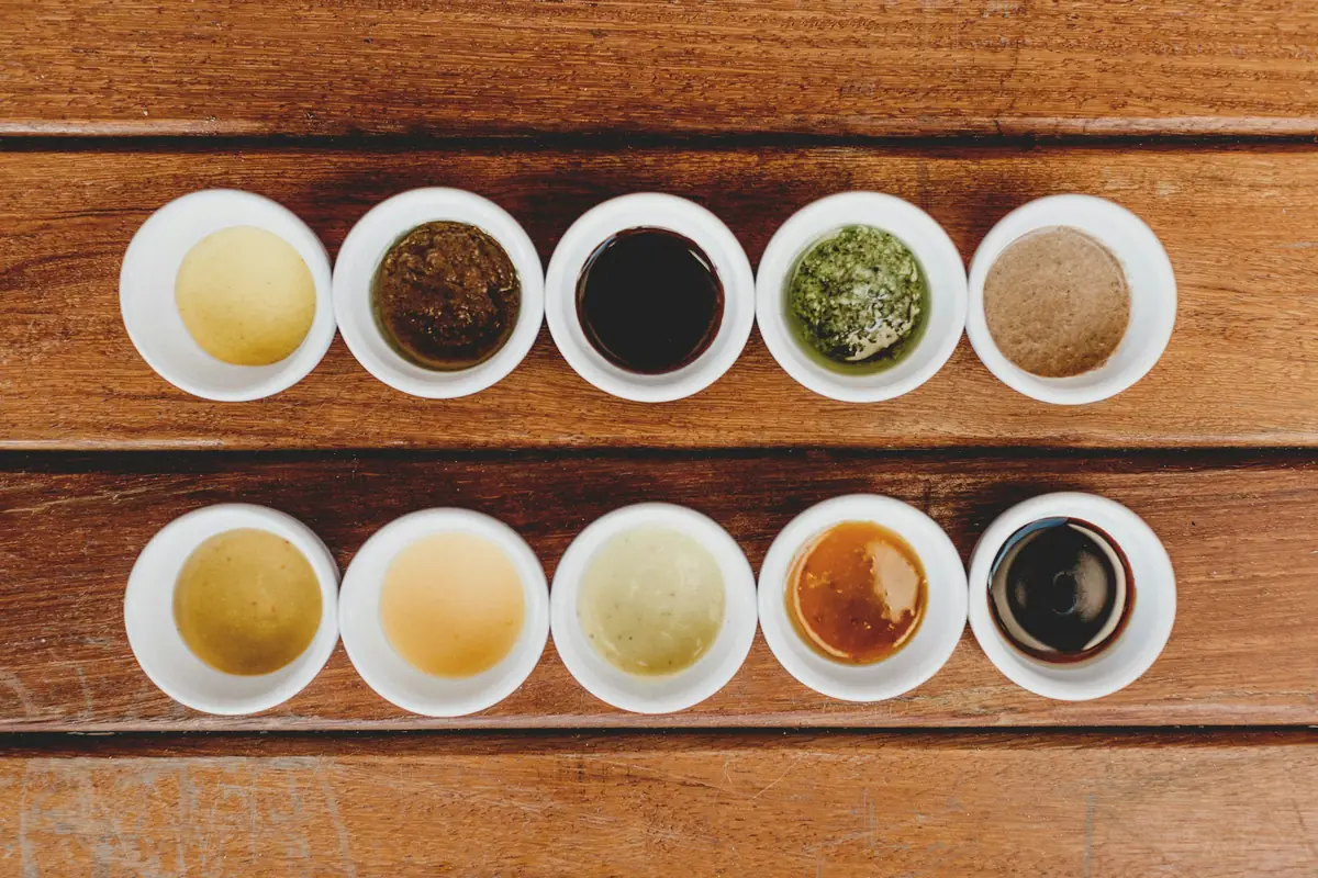 Cups of tea liquors lined up for tasting